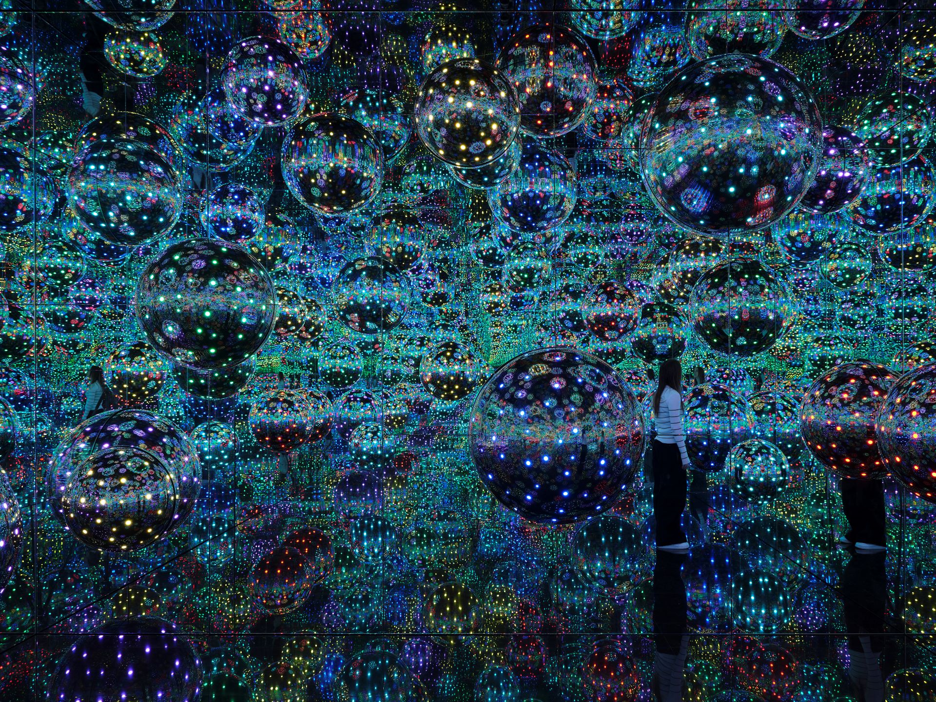 Yayoi Kusama’s <em>Infinity Mirrored Room – My Heart is Filled to the Brim with Sparkling Light</em> 2024, on display as part of Yayoi Kusama at NGV International, Melbourne 15 December 2024 – 21 April 2025 © YAYOI KUSAMA. Photo: Sean Fennessy