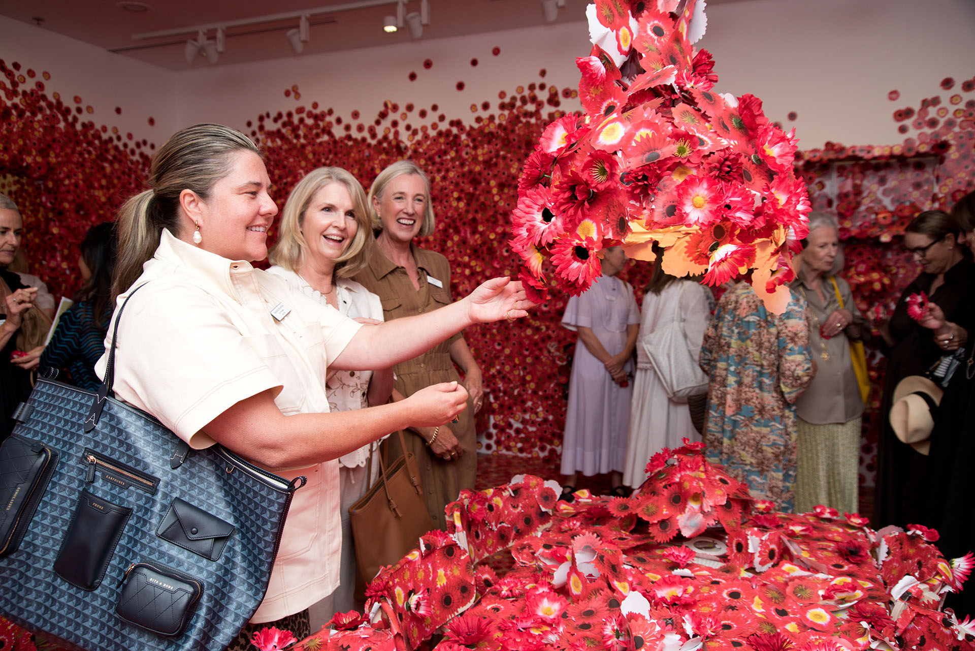 NGVWA members viewing Yayoi Kusama's <em>Flower Obsession</em> 2016–2017